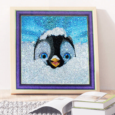 Diamond Painting Kit featuring a cute penguin in snow with vibrant blue background for creative fun
