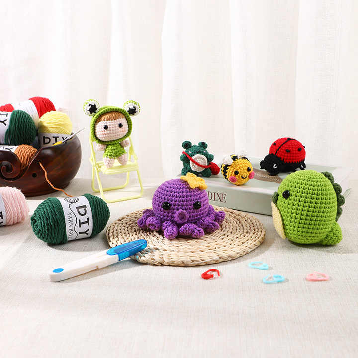 DIY Doll Tool Kit with colorful yarn and cute crocheted animals including an octopus and a frog