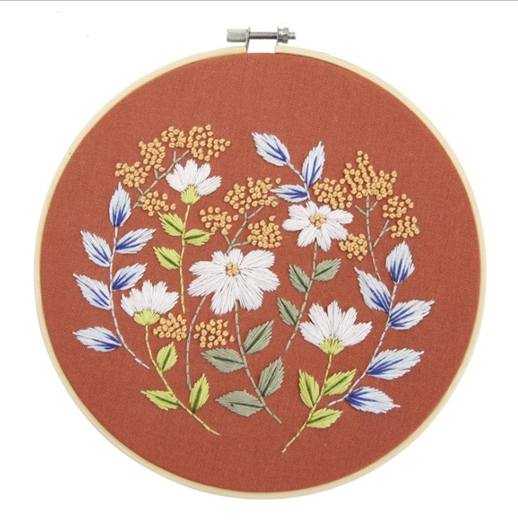 Beautiful DIY Embroidery Practice Kits featuring floral designs on a terracotta background