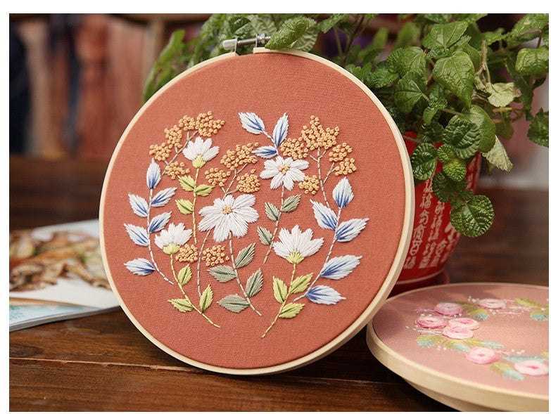 DIY Embroidery Practice Kits featuring floral designs on a terracotta fabric background