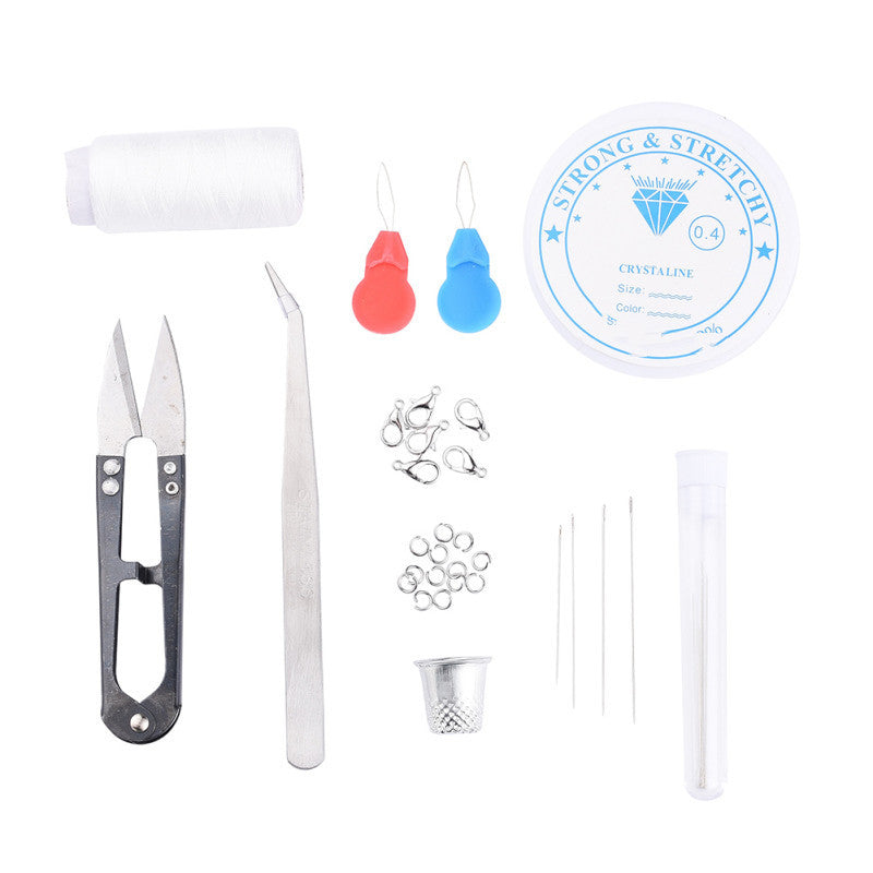 DIY Jewelry Making Kit featuring tools, threads, beads, and accessories for crafting unique jewelry