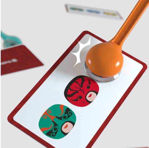 Arts And More Find Picture Game card with colorful masked faces and orange magnifying glass tool