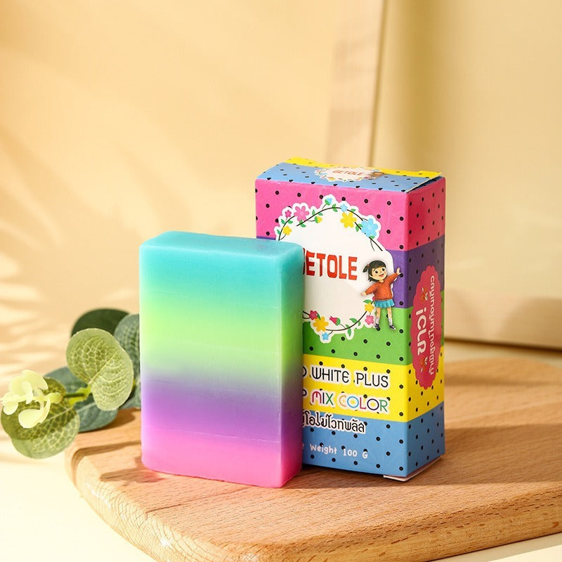 Arts And More Oil Bath Soap for Kids with colorful gradient bar and vibrant packaging on wooden board