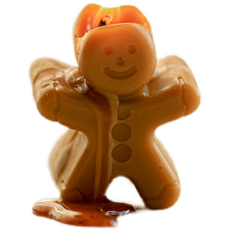 Cute gingerbread candles shaped like cheerful gingerbread men for festive home decor