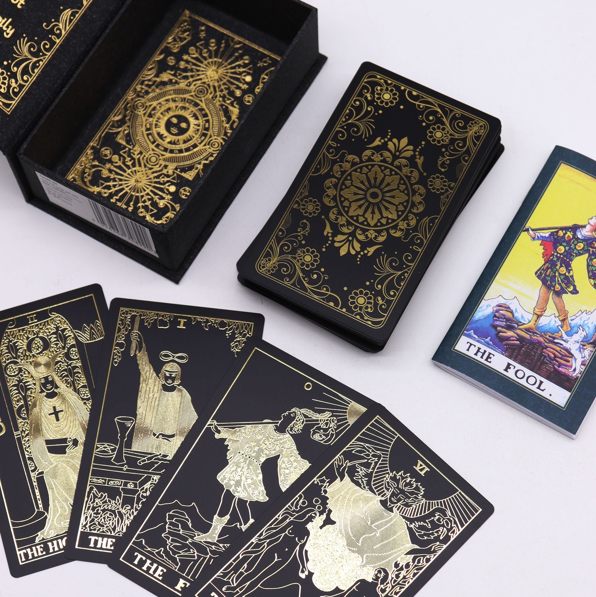 Gold Foil Tarot Set with black cards and intricate designs for mystical readings