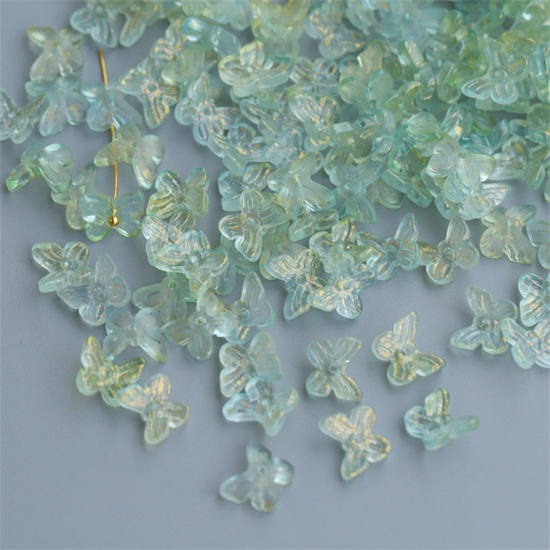 Transparent butterfly shaped craft pieces used as hairpin materials for decorative hair accessories