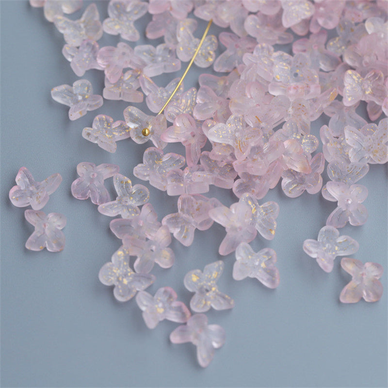 Pink translucent butterfly-shaped craft beads with glitter used as hairpin materials from Arts And More