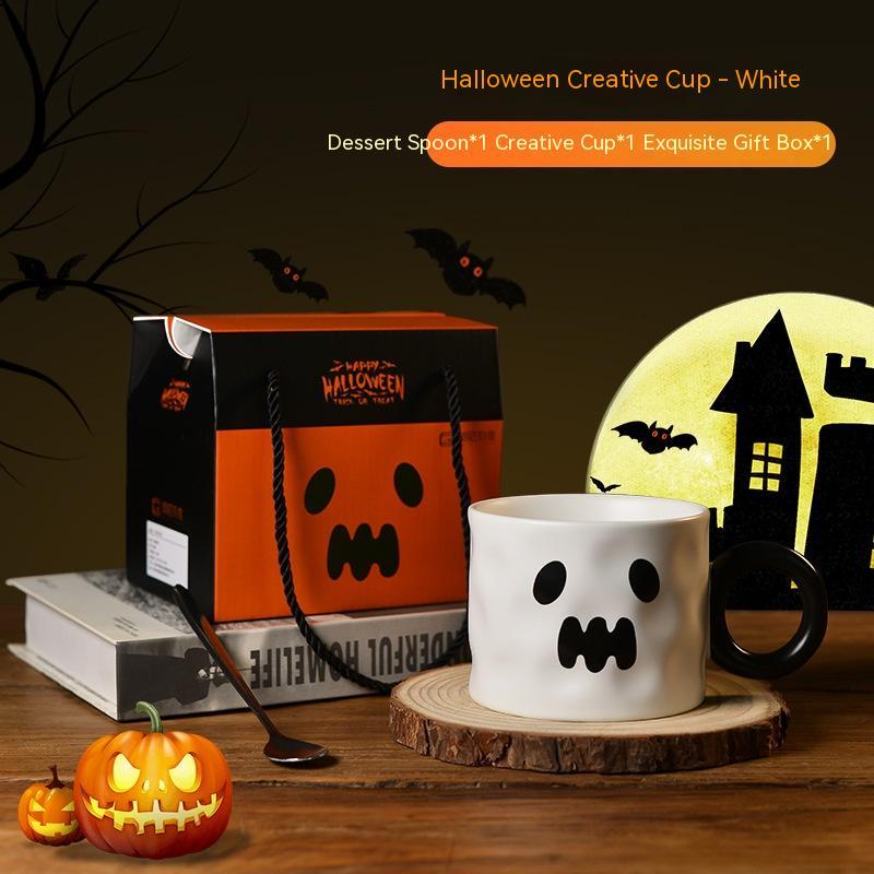 Halloween Pumpkin Cup in White with a spooky design, includes dessert spoon and gift box from Arts And More