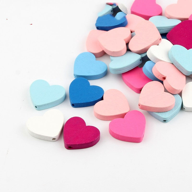 Colorful heart-shaped wooden beaded materials in pink blue white and red for craft projects