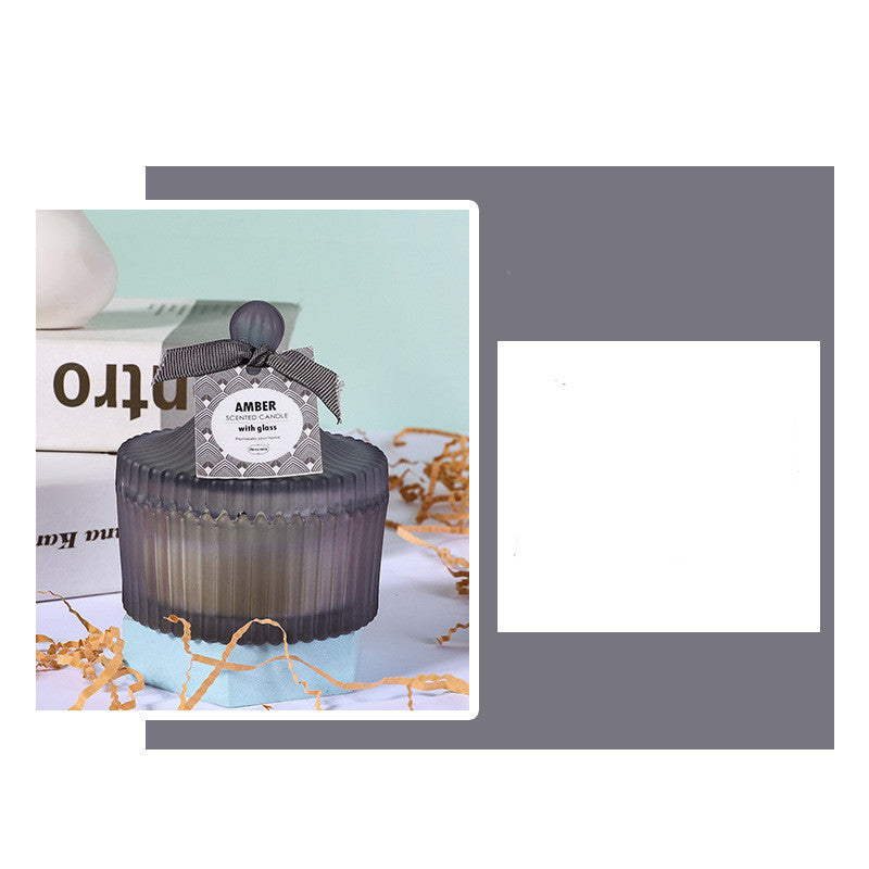 Elegant amber indoor scented candle gift with decorative lid and textured glass design