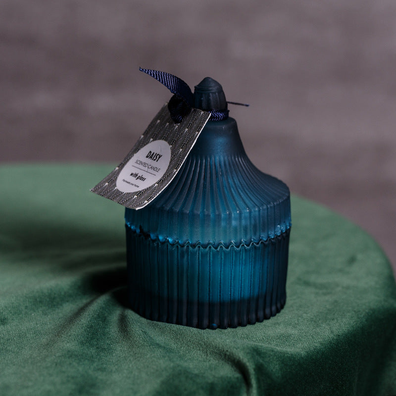 Elegant blue indoor scented candle gift with a textured design and decorative tag for a chic home ambiance