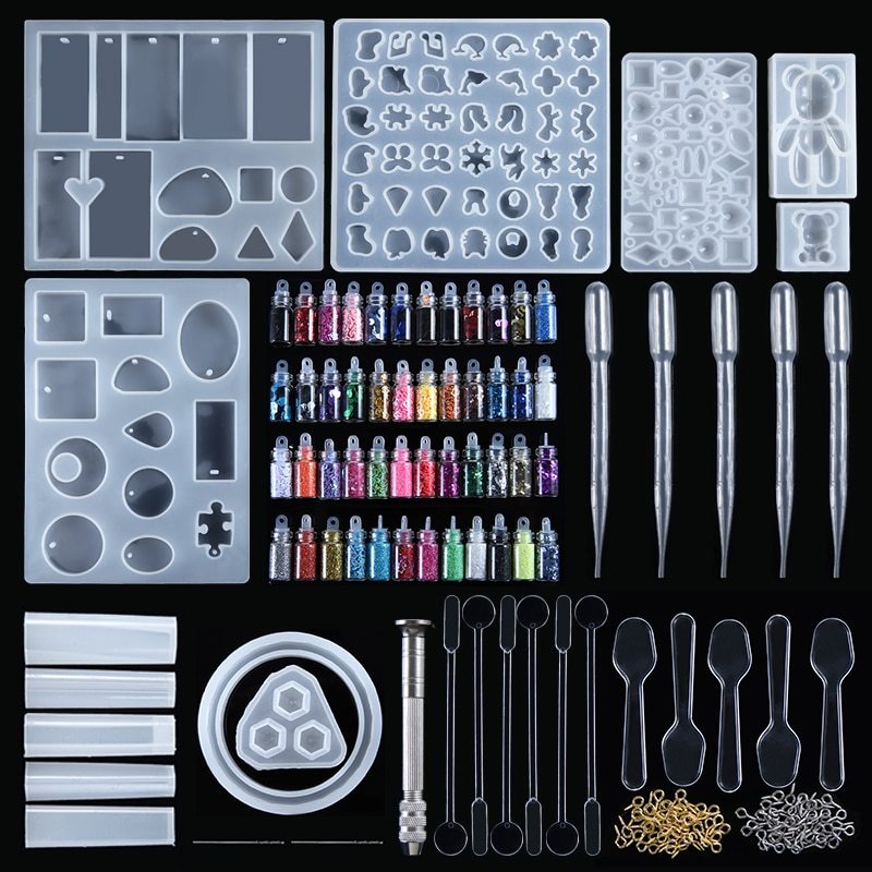 Assorted craft materials for jewelry pendant making geometric mold with molds, glitters, tools, and supplies