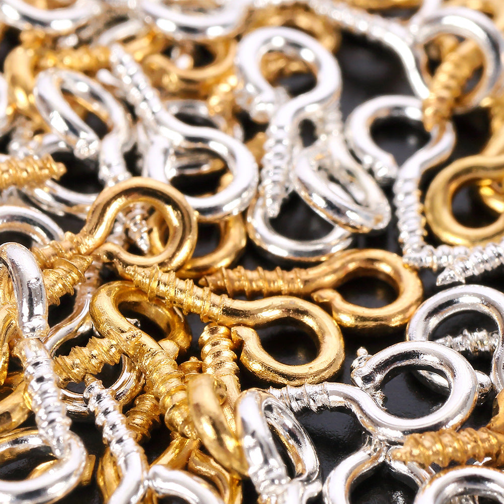 Close-up of gold and silver craft hooks used with Letter Resin Molds for jewelry making