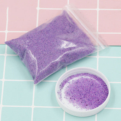 Purple Magic Sand for Kids DIY Kits by Arts And More in a clear plastic bag with some in a white lid