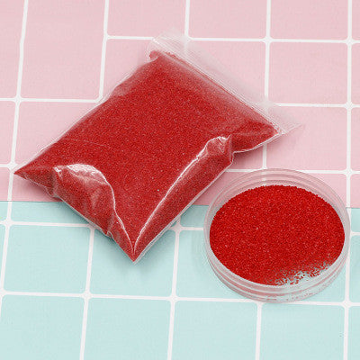 Red Magic Sand in a pouch and container, perfect for kids DIY projects and creative play