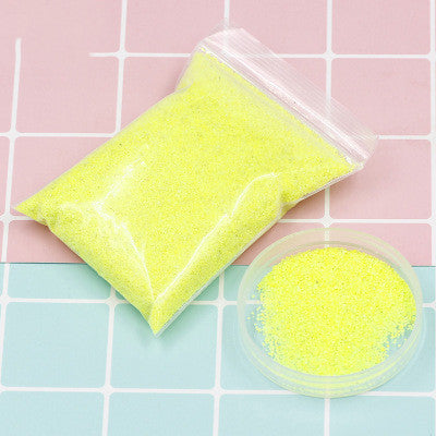 Arts And More Kids DIY Kits Magic Sand in yellow color inside a plastic bag and small container