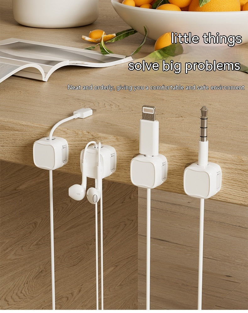 Organized Magnetic Cable Clips holding various cables on a wooden surface for neat charging spaces