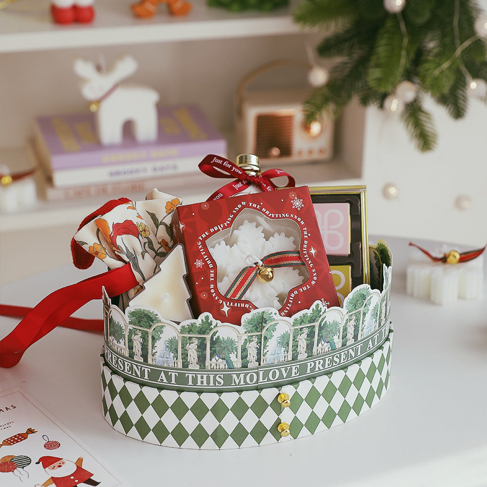 Snowflake Christmas Candle Gift beautifully arranged in a festive decorative basket with ribbons