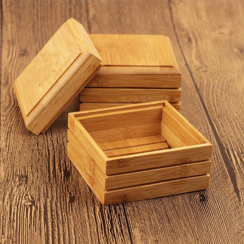 Arts And More Natural Lotus Soap Box made of bamboo wood with removable lid on wooden surface