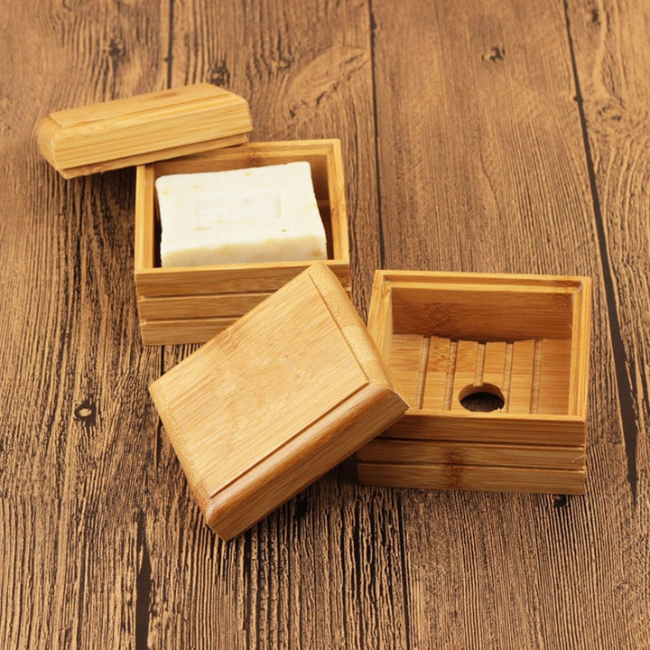 Natural Lotus Soap Box by Arts And More with wooden design and removable lid on wooden surface