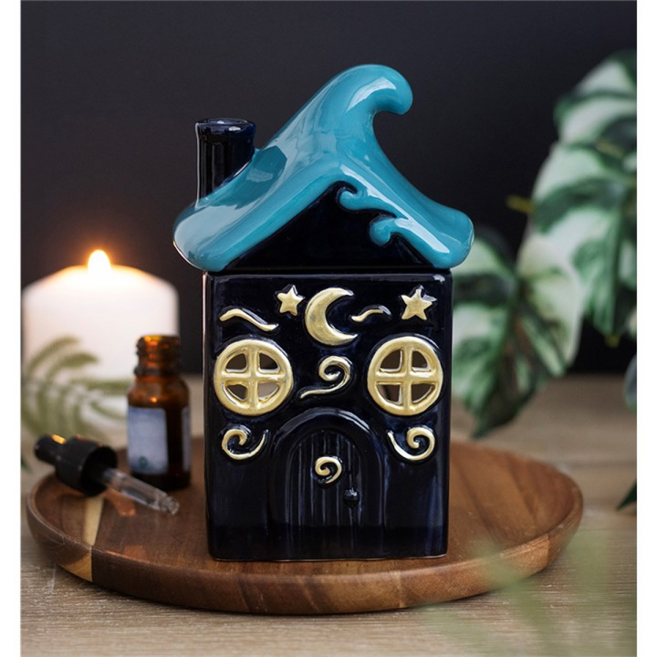 Ceramic oil burner shaped like a house for aromatherapy