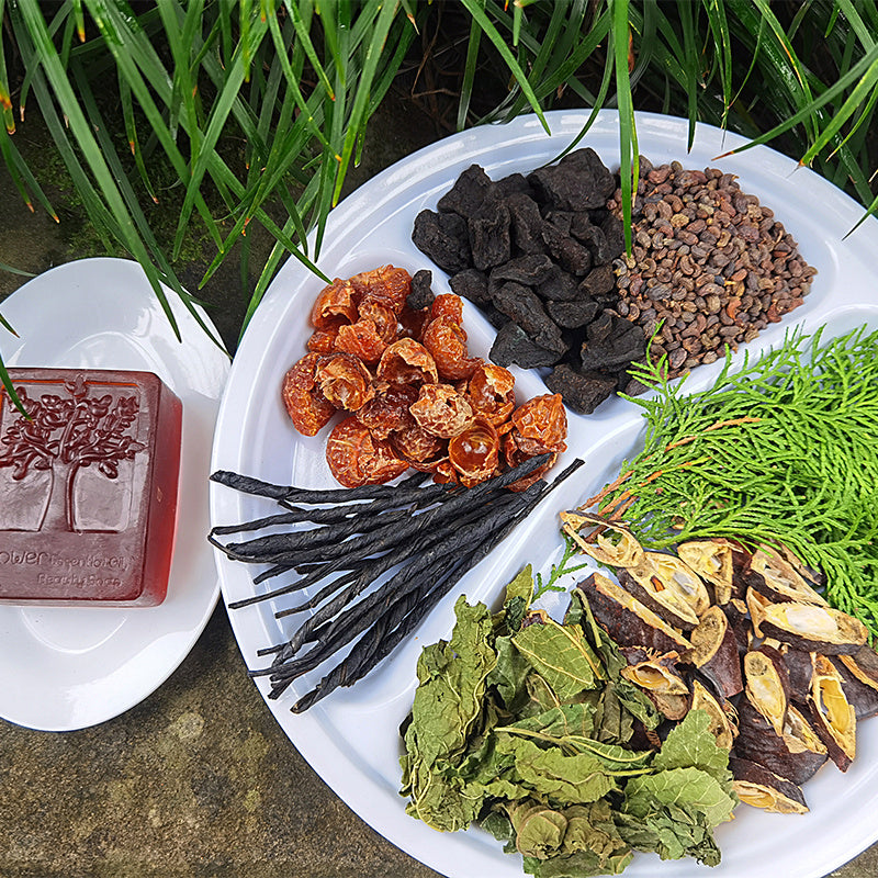 Arts And More Anti-Hair Loss Soap with natural herbal ingredients displayed on white plates