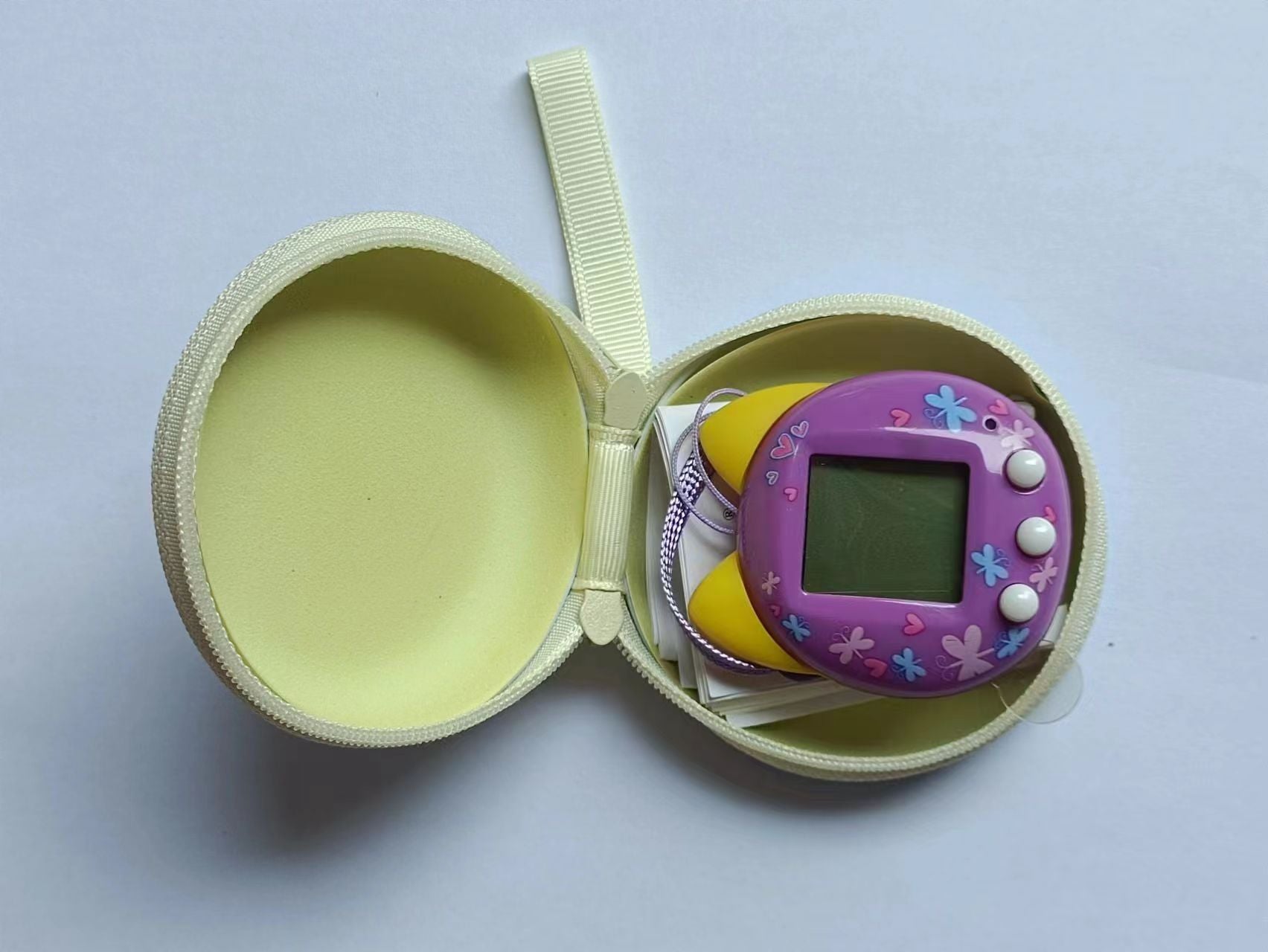 Pet Machine Elf interactive toy in a yellow case for kids' DIY fun and creativity