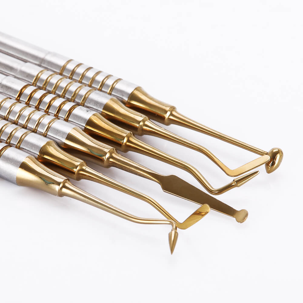 Set of five gold-and-silver sculpting tools for applying resin filler in craft projects