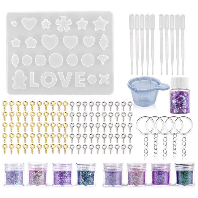 Arts And More Resin Jewelry Silicone Molds kit with heart and star shapes, glitter, keychain rings, and droppers