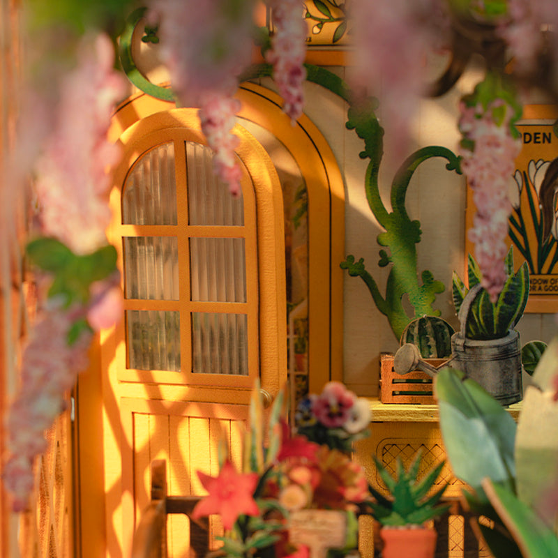 Rolife Garden House Book Nook Kit with vibrant plants and intricate details inside a cozy setting