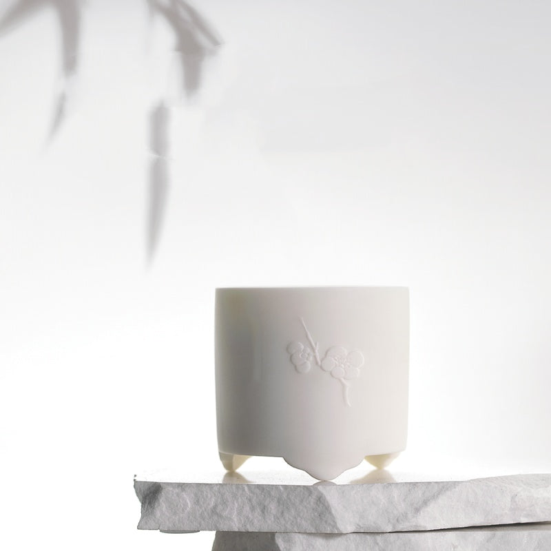 Elegant white decorative holder with Snow Moon Scented Candles for a serene ambiance