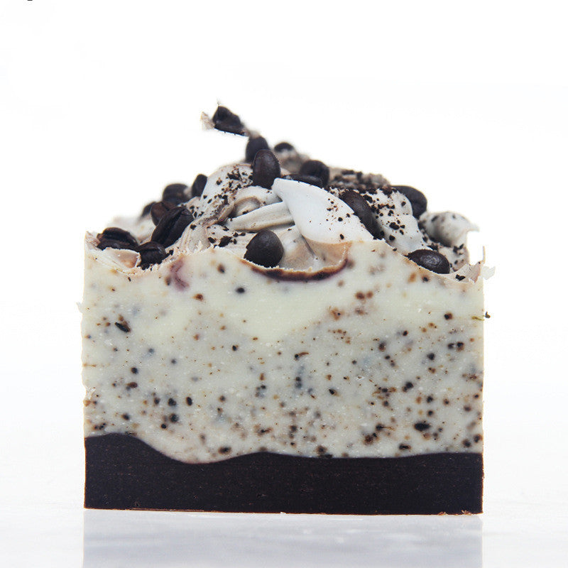 Arts And More Coffee Essential Oil Soap with coffee grounds and cream swirls on top