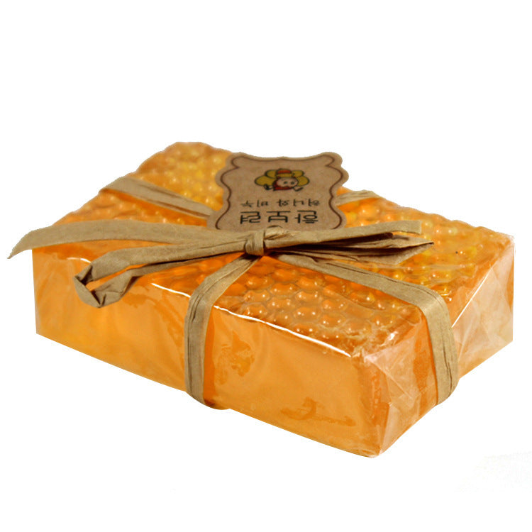 Arts And More Propolis Honey Soap wrapped in honeycomb-patterned packaging with a rustic bow