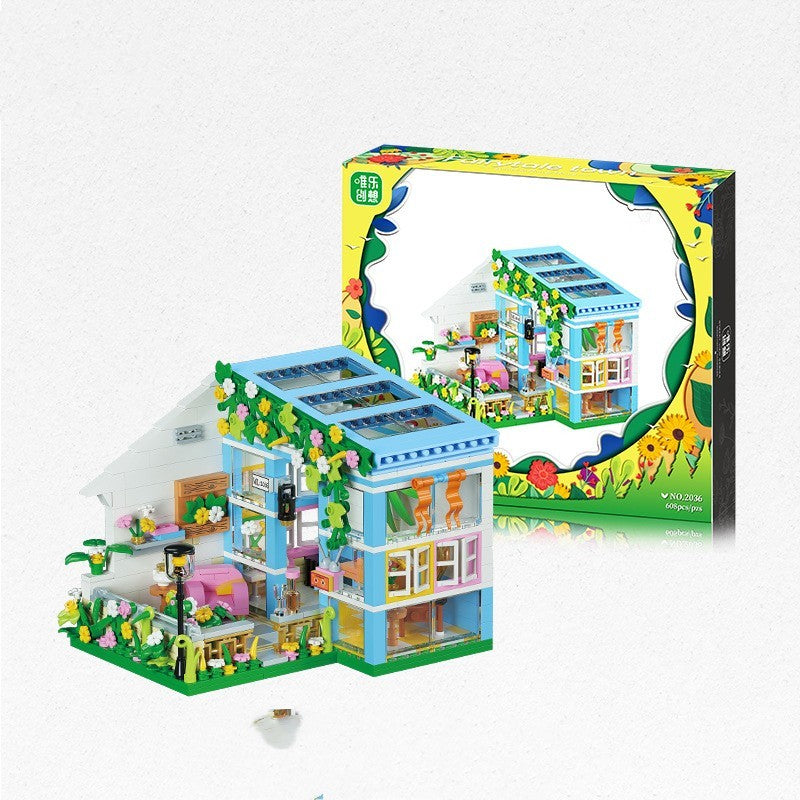 Arts And More Small House Puzzle Toy Kit featuring colorful building pieces and garden decorations