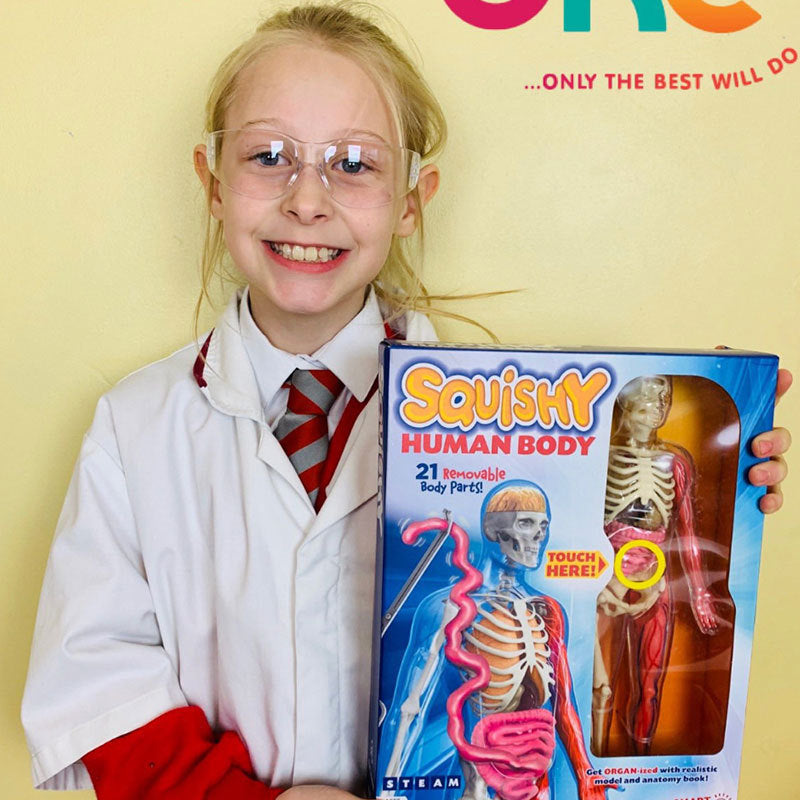 Child holding Arts And More Kids DIY Kits Squishy Human Body 3D Model Toy with removable parts