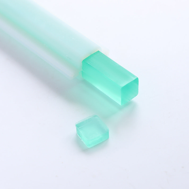 Square translucent teal soap made using Arts And More Soap Silicone Mold on white background