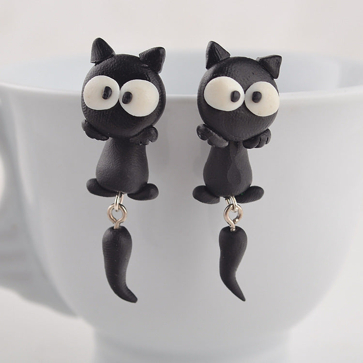 Arts And More black cat soft clay earrings with big white eyes and dangling tails