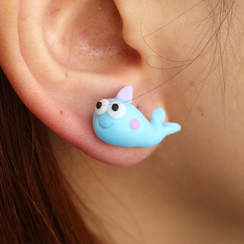 Blue whale shaped Soft Clay Earrings worn on ear handcrafted by Arts And More