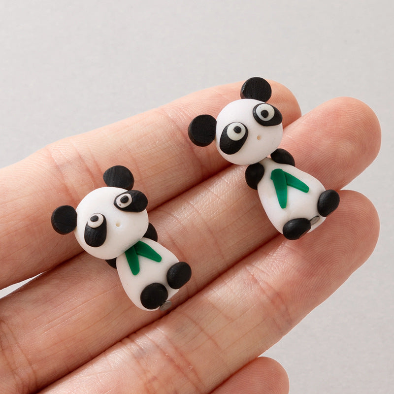 Arts And More Soft Clay Earrings shaped like cute black and white pandas with green scarves