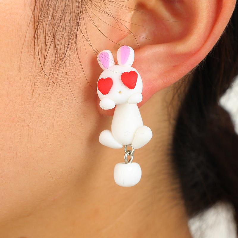 Soft Clay Earrings by Arts And More featuring white bunny with red heart eyes and dangling tail decoration