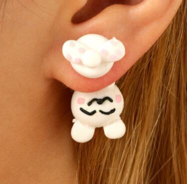 White soft clay earrings shaped like a cute bear with pink cheeks worn on ear by Arts And More