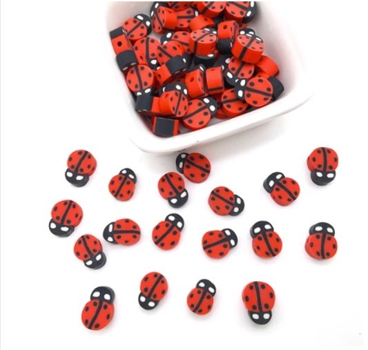 Red and black ladybug shaped beads for string beading craft projects by Arts And More