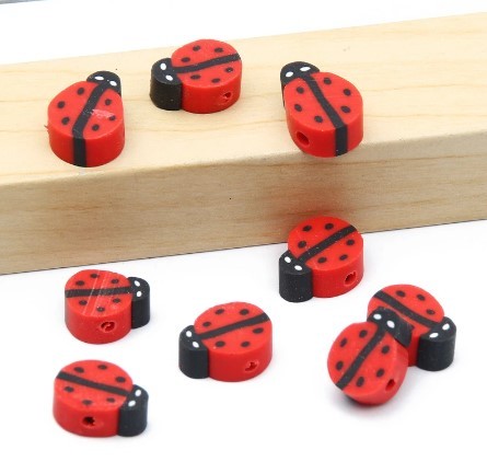 Red and black ladybug beads for string beading craft materials by Arts And More