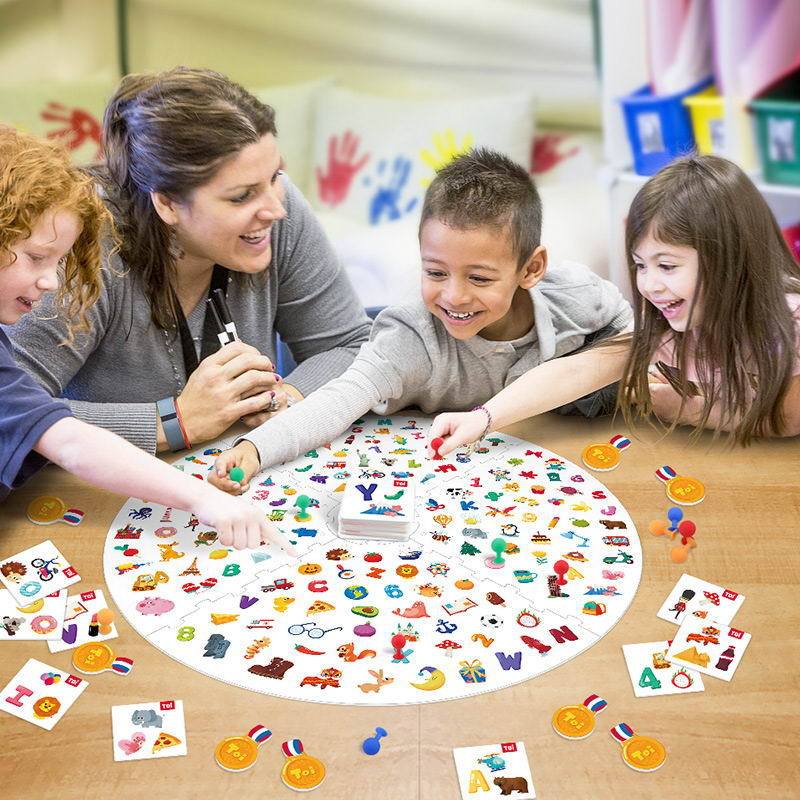 Children and adult playing Find It Table Game with colorful objects on round board from Arts And More