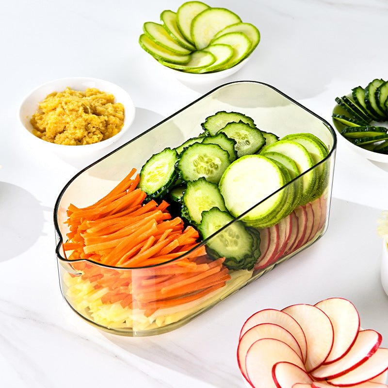 Arts And More Vegetable Cutter with sliced cucumbers, carrots, and radishes arranged in a serving tray
