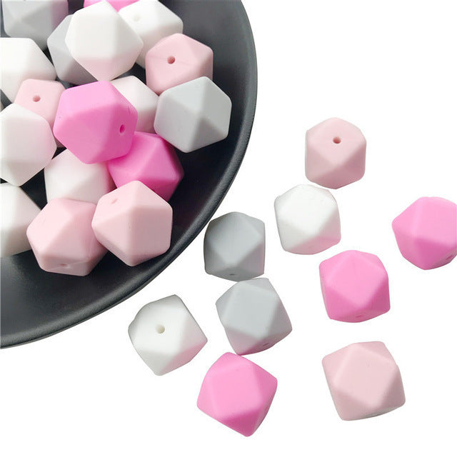 Arts And More hexagon beads in pink white and gray for crafting projects