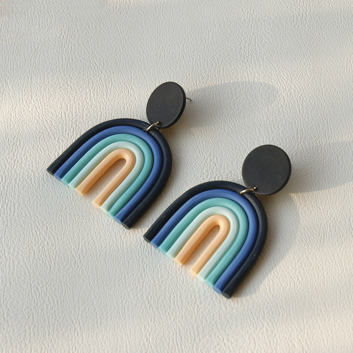 Arts And More Rainbow Polymer Clay Earrings in pastel blue and beige tones with black studs