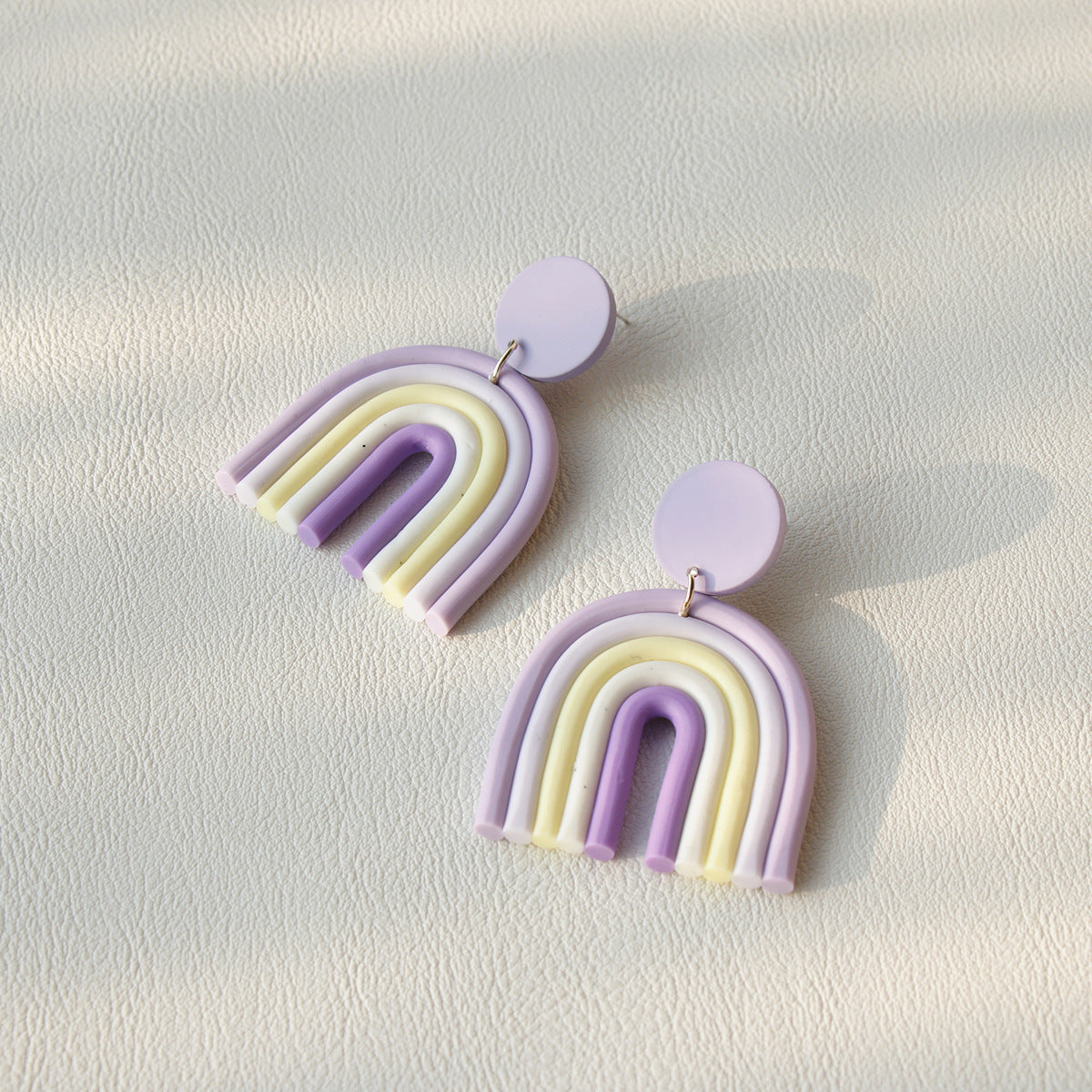 Rainbow Polymer Clay Earrings in pastel purple, white, and yellow arch design from Arts And More