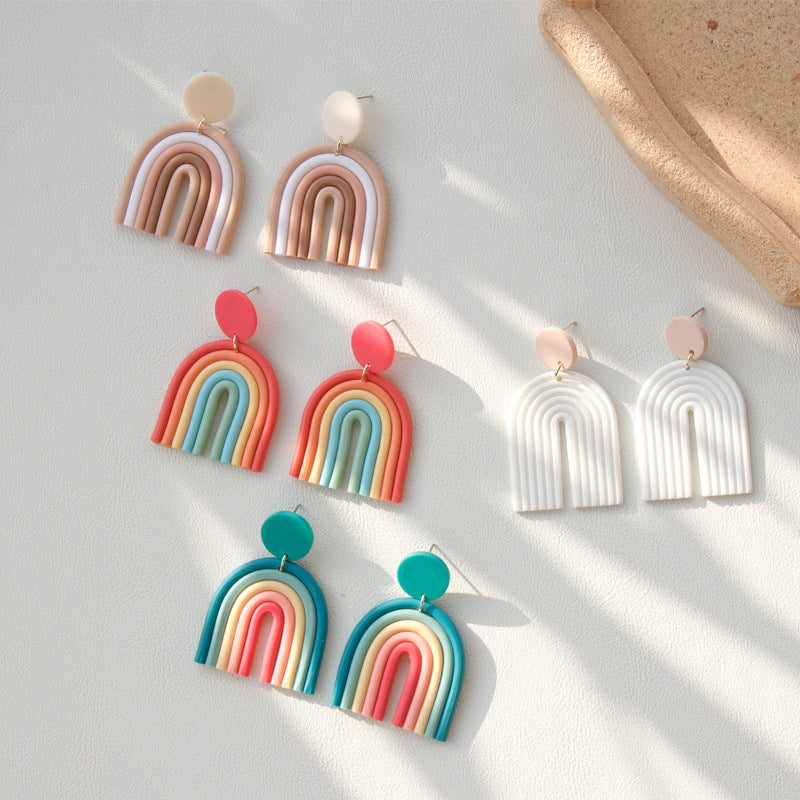 Arts And More Rainbow Polymer Clay Earrings in multiple colorful and neutral designs displayed on a white surface