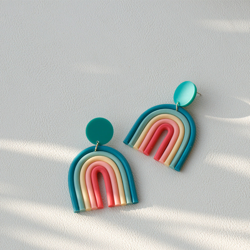 Arts And More Rainbow Polymer Clay Earrings with multicolor arch design on white background